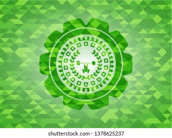 weightlifting inside of crown icon inside green mosaic emblem