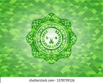 weightlifting inside of crown icon inside green emblem with mosaic background