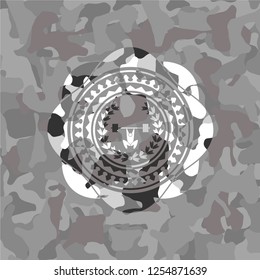 weightlifting inside of crown icon inside grey camouflaged emblem