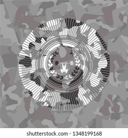 weightlifting inside of crown icon inside grey camouflage emblem