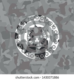 weightlifting inside of crown icon inside grey camouflage emblem