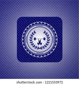 weightlifting inside of crown icon inside jean or denim emblem or badge background