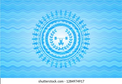 weightlifting inside of crown icon inside light blue water style badge.