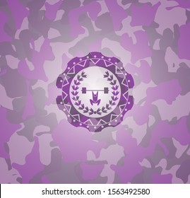 weightlifting inside of crown icon inside pink and purple camouflage emblem