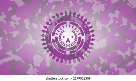 weightlifting inside of crown icon inside pink camo emblem. 