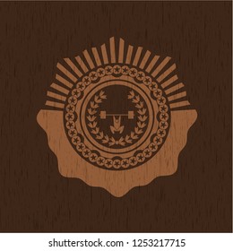 weightlifting inside of crown icon inside retro wooden emblem
