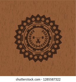 weightlifting inside of crown icon inside retro wood emblem