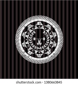 weightlifting inside of crown icon inside silver emblem or badge