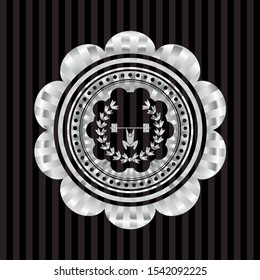weightlifting inside of crown icon inside silvery badge or emblem