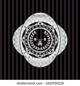 weightlifting inside of crown icon inside silvery emblem or badge
