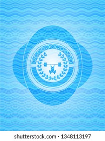 weightlifting inside of crown icon inside sky blue water wave style badge.