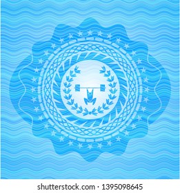 weightlifting inside of crown icon inside sky blue water emblem background.
