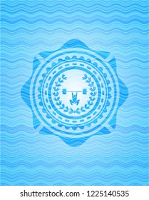 weightlifting inside of crown icon inside water wave representation badge.