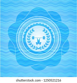 weightlifting inside of crown icon inside water wave representation style emblem.