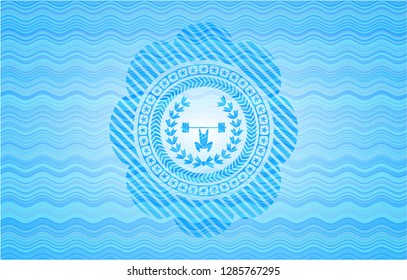 weightlifting inside of crown icon inside water concept style badge.
