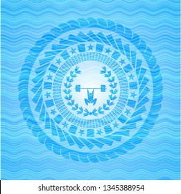 weightlifting inside of crown icon inside water representation emblem.