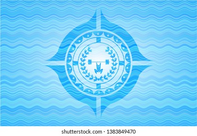 weightlifting inside of crown icon inside water wave emblem.