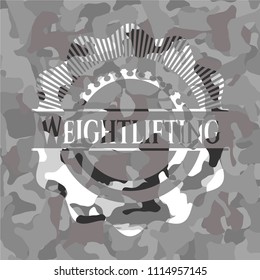 Weightlifting on grey camouflaged texture