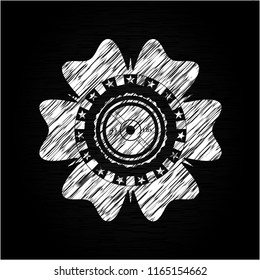 weightlifting or powerlifting plate (45 lbs) icon inside chalkboard emblem on black board