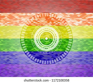 weightlifting or powerlifting plate (45 lbs) icon inside emblem on mosaic background with the colors of the LGBT flag
