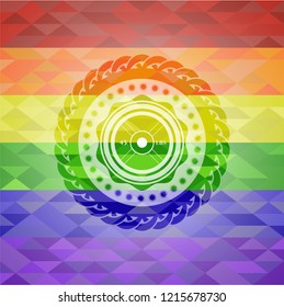 weightlifting or powerlifting plate (45 lbs) icon on mosaic background with the colors of the LGBT flag