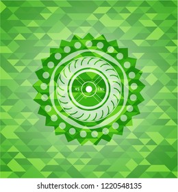weightlifting or powerlifting plate (45 lbs) icon inside green emblem with triangle mosaic background