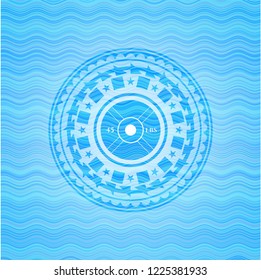 weightlifting or powerlifting plate (45 lbs) icon inside sky blue water emblem.