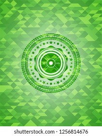 weightlifting or powerlifting plate (45 lbs) icon inside green emblem with triangle mosaic background