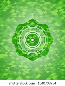 weightlifting or powerlifting plate (45 lbs) icon inside realistic green emblem. Mosaic background
