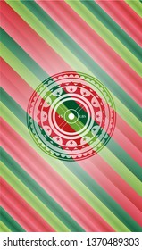 weightlifting or powerlifting plate (45 lbs) icon inside christmas emblem background.