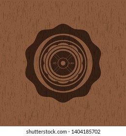 weightlifting or powerlifting plate (45 lbs) icon inside retro wood emblem