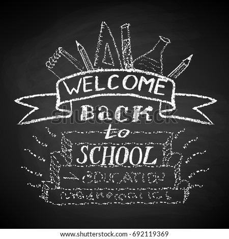 Welcome Back to School. Chalk text and drawing on blackboard.