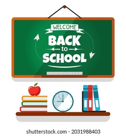 Welcome back to school. Drawing with chalk on a chalkboard with school stuff.