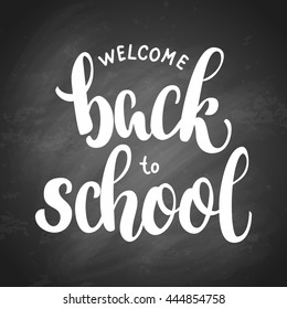 Welcome back to school hand brush lettering, on black chalkboard background. Vector illustration.