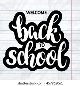 Welcome back to school hand brush lettering, on notepad crumpled paper background, with black thick backdrop. Vector illustration.