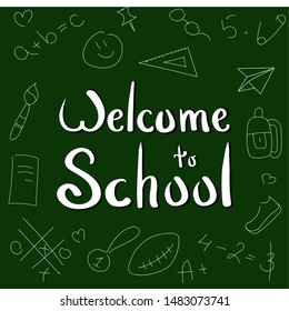 Welcome back to school. Hand lettering with icons elements on green blackboard background.
