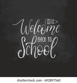 Welcome Back To School handwritten illustration with pencil drawing on chalkboard. Vector hand lettering. Children education background. Knowledge day poster.