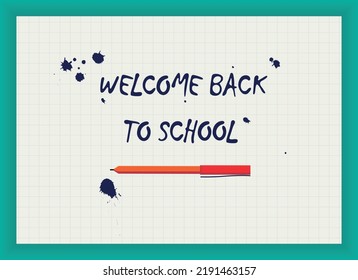 Welcome back to school message written in the notebook with a pen and blotches.