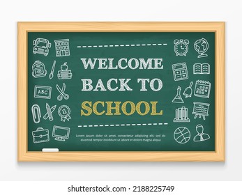 Welcome back to school text and hand drawn icons on blackboard