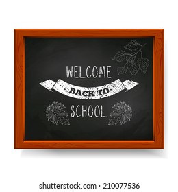 Welcome back to school text written in chalk on blackboard