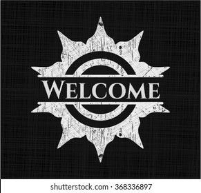Welcome chalk emblem written on a blackboard