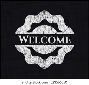 Welcome chalkboard emblem on black board