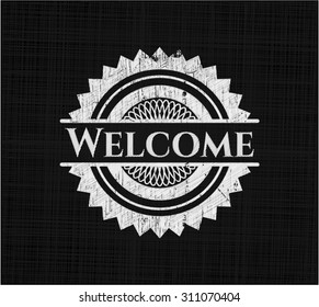 Welcome chalkboard emblem written on a blackboard