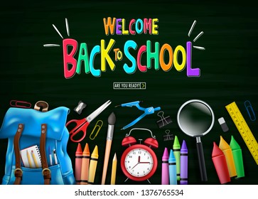 Welcome Colorful Back to School Message in Green Chalkboard Top View with Blue Backpack and School Supplies Like Notebook, Pen, Pencil, Colors, Ruler, Magnifying Glass, Eraser, Paper Clip, Sharpener, 