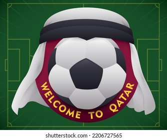 Welcome design for Qatar sport event with white kufiya covering a round button and soccer ball over green background.