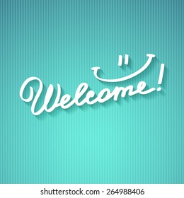 welcome, handwritten text with shadow on striped cardboard