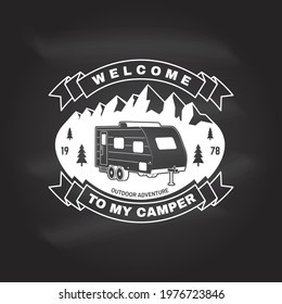 Welcome to my camper. Vector chalkboard Concept for shirt or logo, print, stamp or tee. Vintage typography design with camper trailer and mountain silhouette. Camping quote.