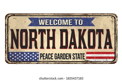 Welcome to North Dakota vintage rusty metal sign on a white background, vector illustration