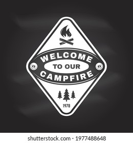 Welcome to our campfire. Camping quote. Vector on the chalkboard Concept for shirt or logo, print, stamp or tee. Vintage typography design with campfire and forest silhouette. Summer camp.