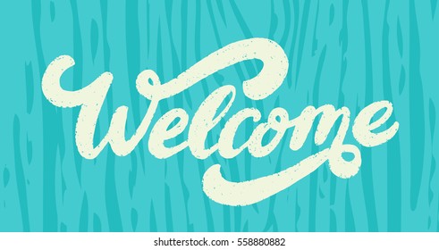 Welcome sign on wood background.
